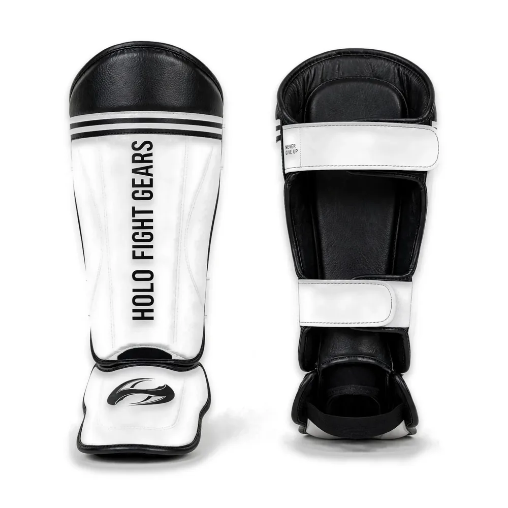 Black and white Holo Fight Gears shin guards, front and back view